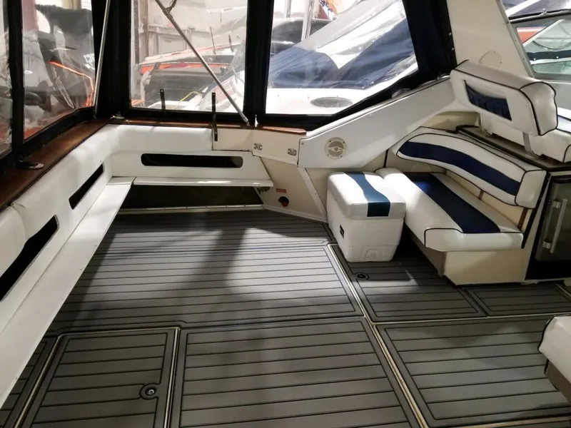 Slide: The Image of 1986 Sea Ray 390 Express boat interior with seating and storage compartments. - 23