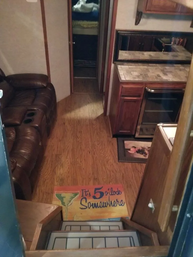 Slide: The Image of Interior of 1986 Sea Ray 390 Express with leather seating and kitchen area. - 25