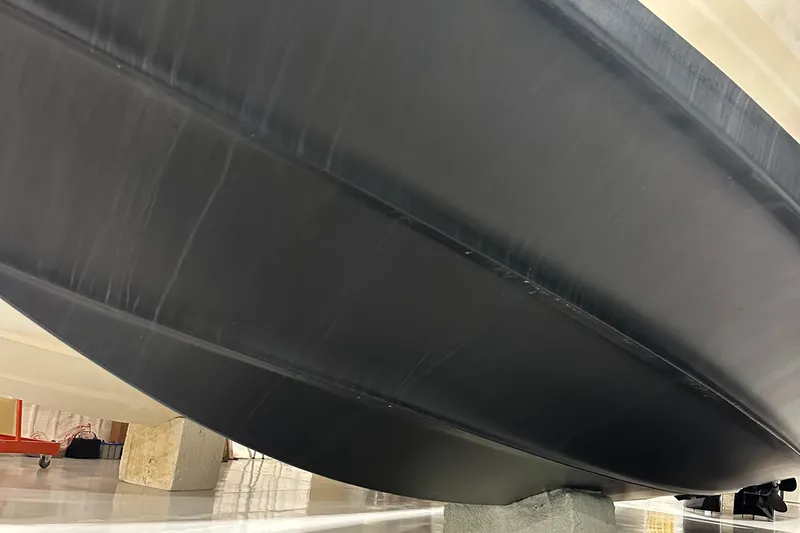 Slide: The Image of 1986 Sea Ray 390 Express boat hull in dry dock. - 27