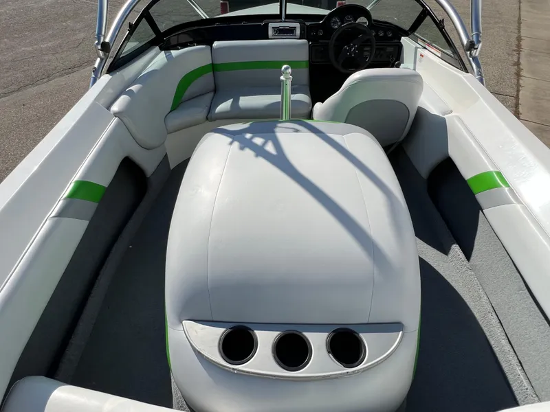 Slide: The Image of 2003 MasterCraft X5 boat interior with white and green seating. - 19
