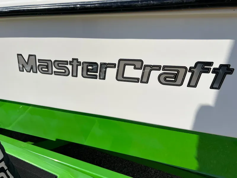 Slide: The Image of 2003 MasterCraft X5 boat logo on white and green hull - 21
