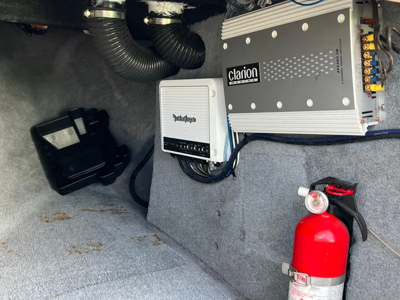 Slide: The Image of 2003 MasterCraft X5 interior with Clarion amplifier, Rockford Fosgate unit, and fire extinguisher. - 9