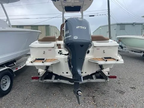 Slide: The Image of 2024 Pioneer 222 Islander boat on trailer with Yamaha outboard motor. - 2