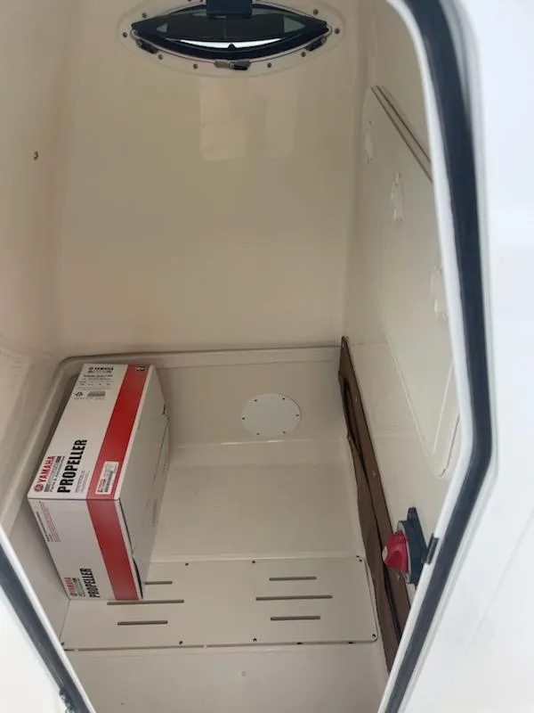 Slide: The Image of 2024 Pioneer 222 Islander boat console with steering wheel and controls. - 7