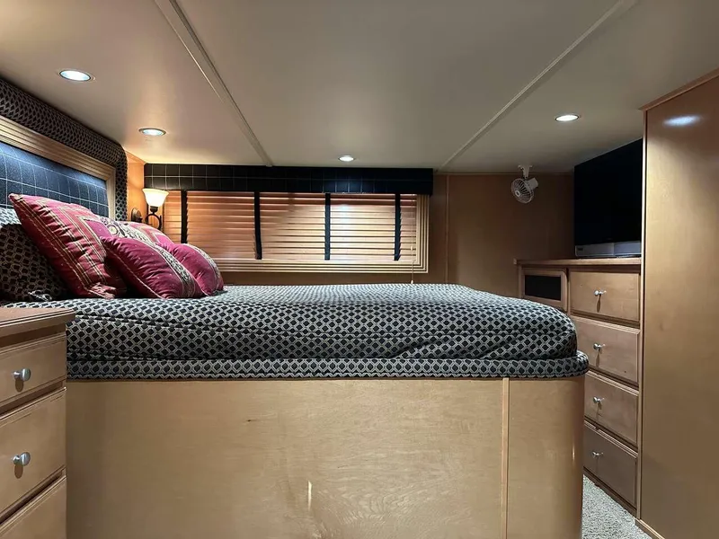 Slide: The Image of Luxurious bedroom interior of a 2005 Sumerset Top Hat houseboat with modern furnishings. - 13