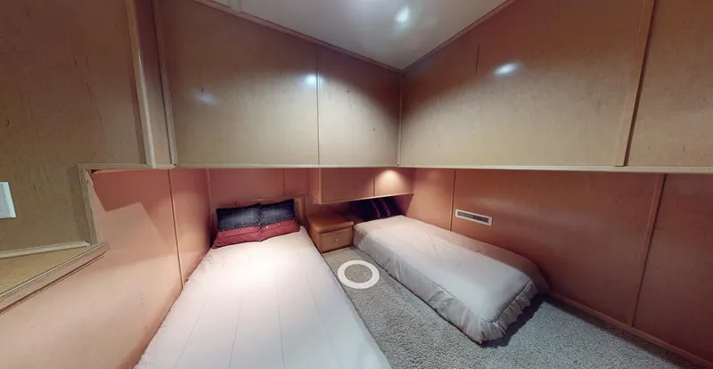 Slide: The Image of 2005 Sumerset Top Hat interior with twin beds and wooden paneling. - 14