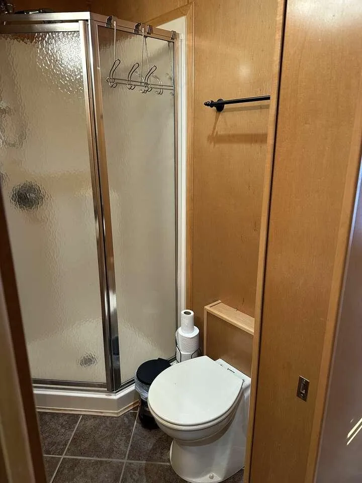 Slide: The Image of Compact bathroom with shower and toilet in 2005 Sumerset Top Hat model. - 16