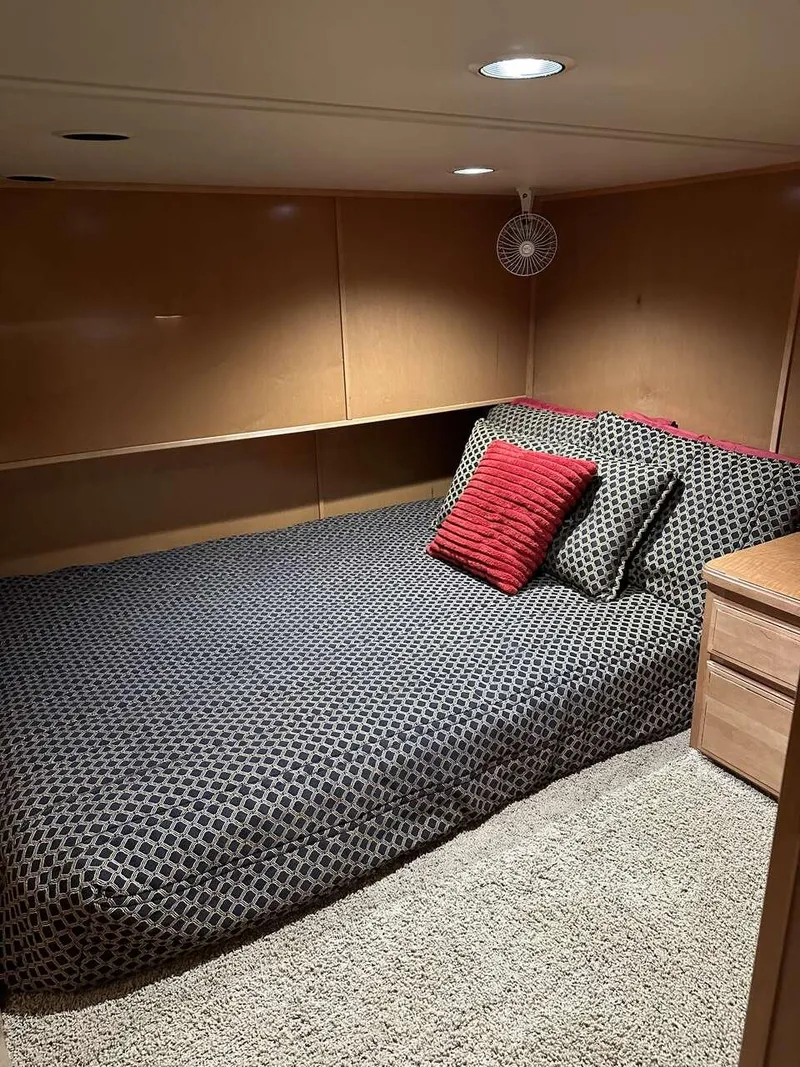 Slide: The Image of Cozy bedroom in 2005 Sumerset Top Hat houseboat with modern decor and plush bedding. - 17