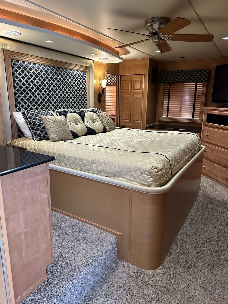 Slide: The Image of Luxurious bedroom in 2005 Sumerset Top Hat houseboat with elegant decor and cozy bedding. - 18