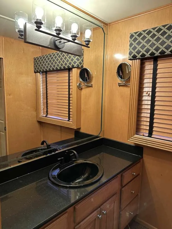 Slide: The Image of Luxurious bathroom in 2005 Sumerset Top Hat, featuring wood accents and modern lighting. - 21