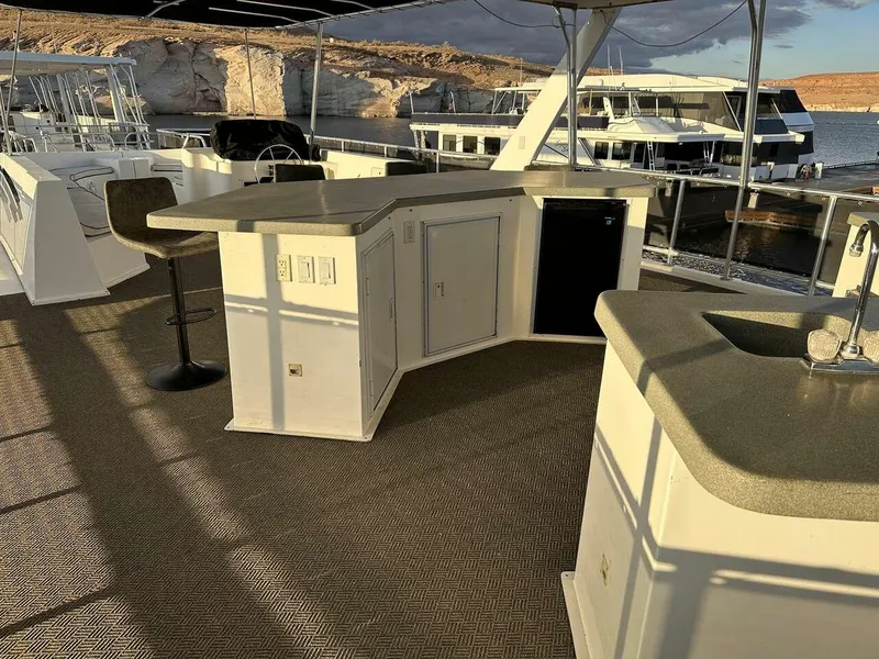 Slide: The Image of 2005 Sumerset Top Hat houseboat interior with bar and seating area. - 27