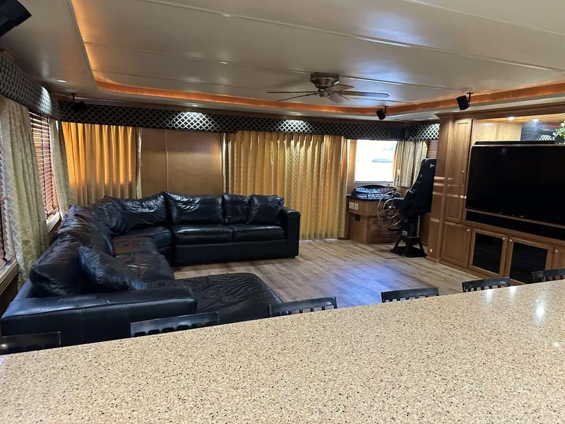 Slide: The Image of Luxurious 2005 Sumerset Top Hat interior with leather seating and entertainment area. - 6