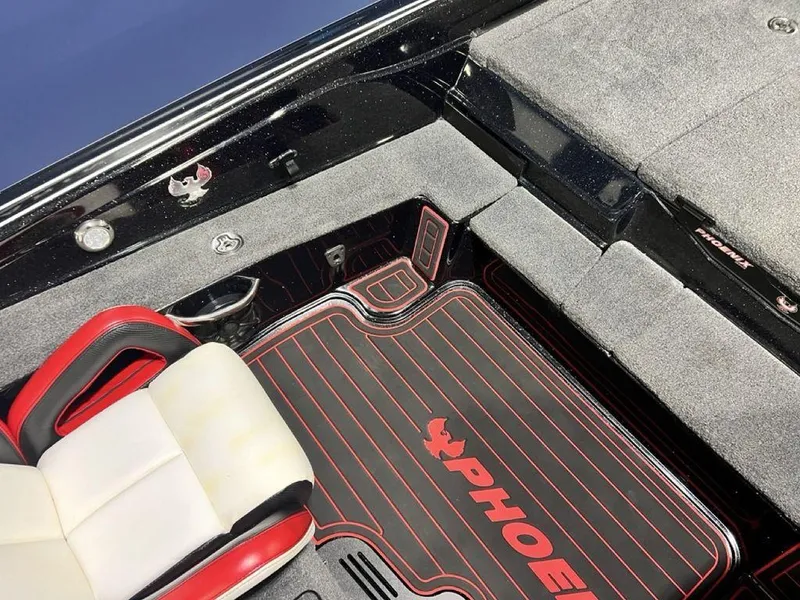 Slide: The Image of 2022 Phoenix 919 Pro XP boat interior with custom seating and flooring. - 18