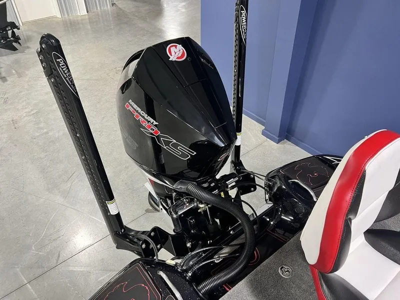 Slide: The Image of 2022 Phoenix 919 Pro XP boat engine with dual power poles in a showroom. - 21