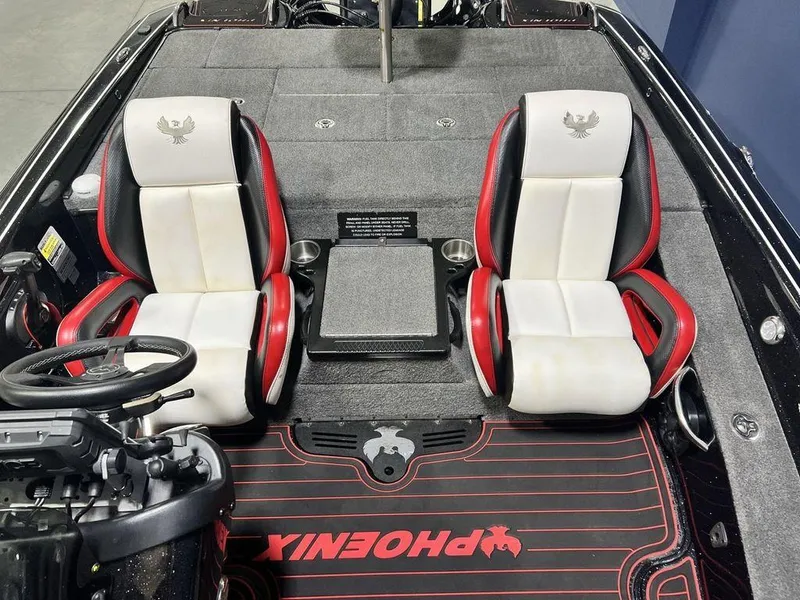 Slide: The Image of 2022 Phoenix 919 Pro XP boat interior with dual seats and steering console. - 26