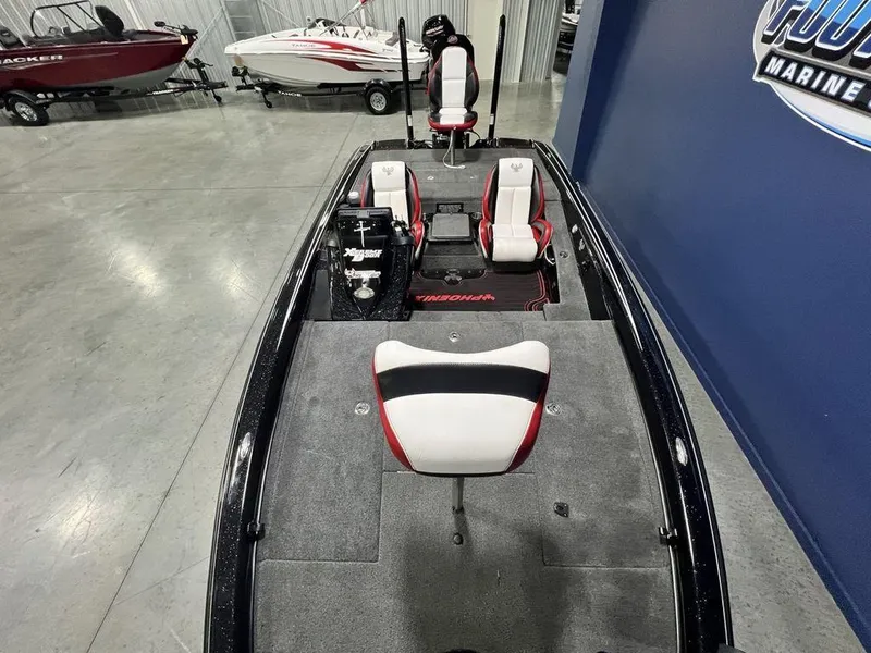 Slide: The Image of 2022 Phoenix 919 Pro XP fishing boat interior with seating and storage compartments. - 27