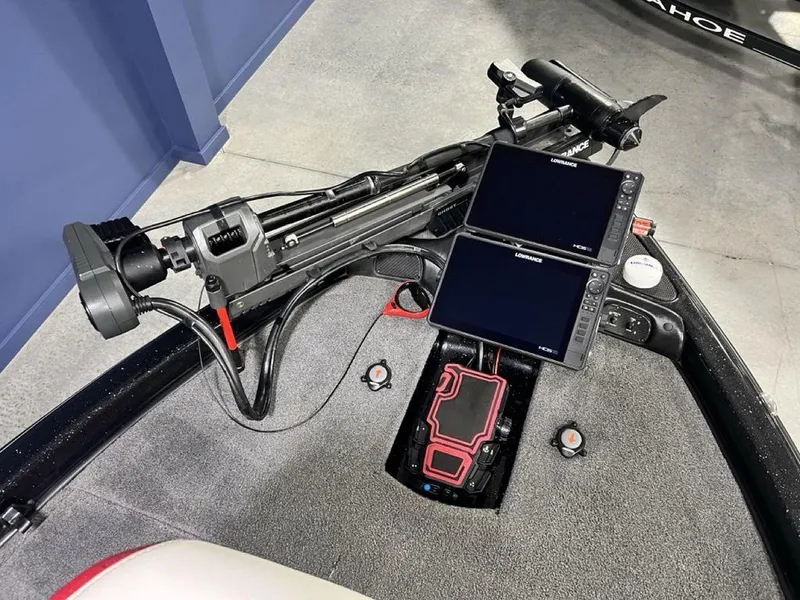 Slide: The Image of 2022 Phoenix 919 Pro XP boat dashboard with dual screens and control panel. - 3