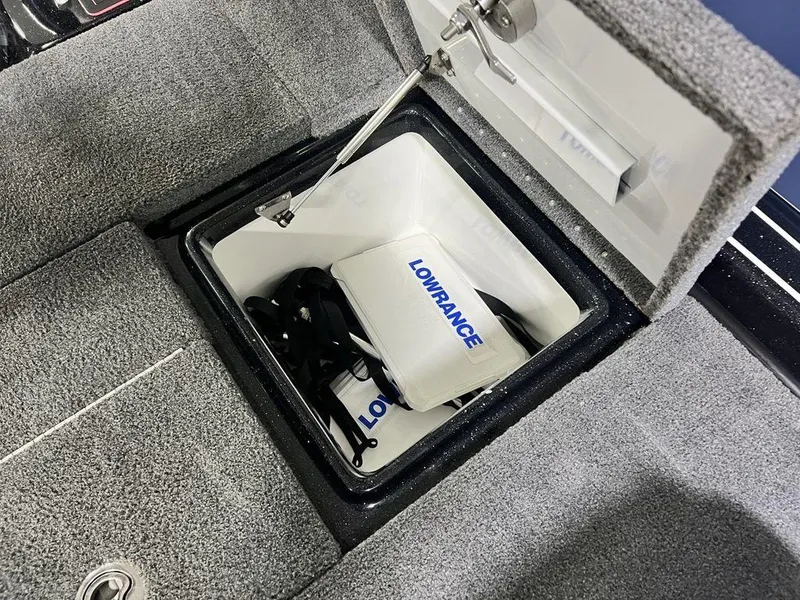 Slide: The Image of Phoenix 919 Pro XP 2022 storage compartment with Lowrance equipment inside. - 32