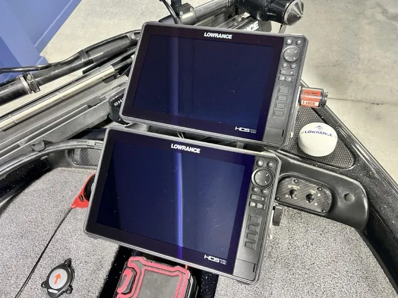 Slide: The Image of Dual Lowrance HDS displays on 2022 Phoenix 919 Pro XP boat dashboard. - 6