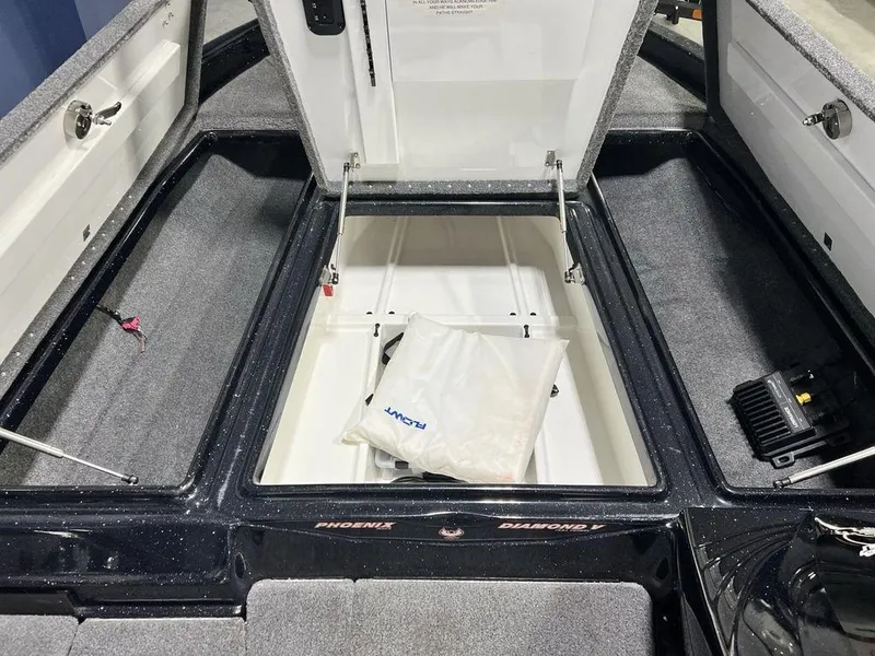 Slide: The Image of 2022 Phoenix 919 Pro XP boat storage compartments open, showcasing interior space. - 9