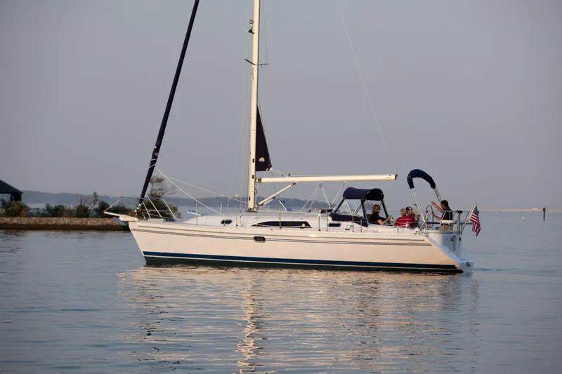 Slide: The Image of 2024 Catalina 355 sailboat cruising on calm waters. - 11