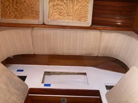 Slide: The Image of Interior of a 1969 Spencer 44 CC sailboat with cushioned seating. - 10