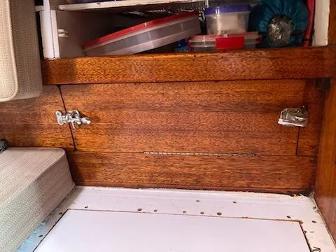 Slide: The Image of Wooden storage compartment in a 1969 Spencer 44 CC sailboat. - 15