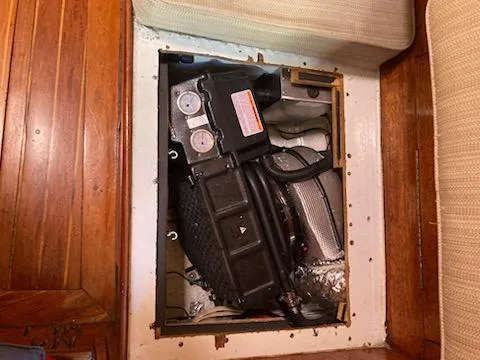 Slide: The Image of Engine compartment of a 1969 Spencer 44 CC sailboat with visible components. - 16