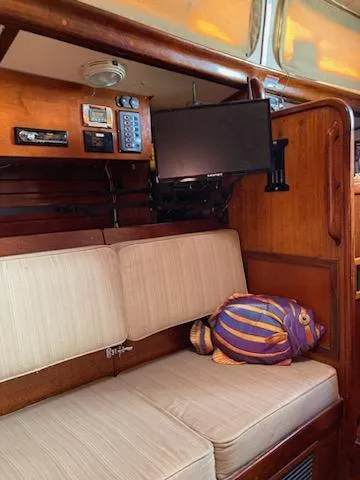 Slide: The Image of Interior of a 1969 Spencer 44 CC sailboat with beige seating and mounted electronics. - 23