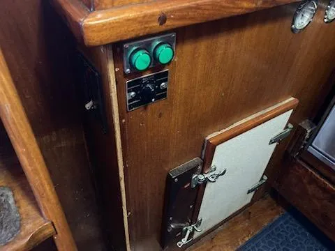Slide: The Image of Control panel and storage compartment on a 1969 Spencer 44 CC sailboat. - 24