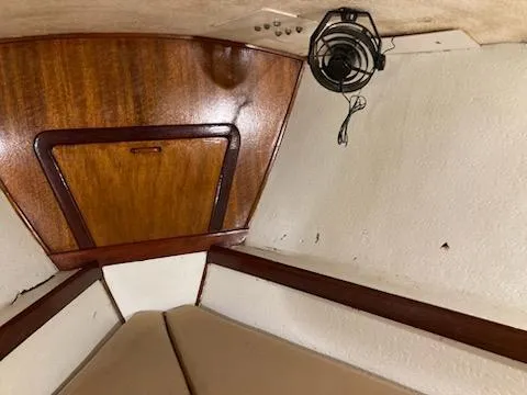 Slide: The Image of Interior cabin of a 1969 Spencer 44 CC sailboat with wooden paneling. - 25