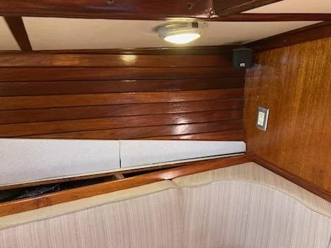 Slide: The Image of Interior of 1969 Spencer 44 CC sailboat with wooden paneling and cushioned seating. - 26