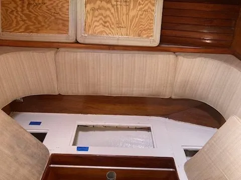 Slide: The Image of Interior seating area of a 1969 Spencer 44 CC sailboat with wooden accents. - 27