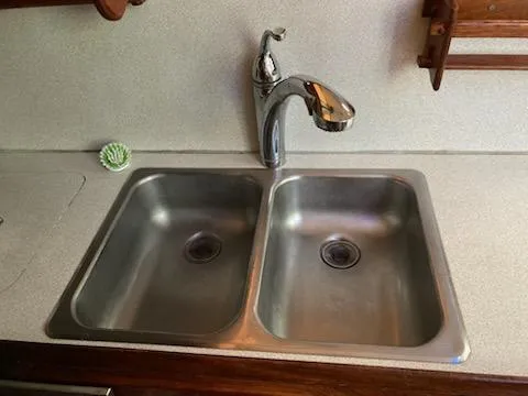Slide: The Image of 1969 Spencer 44 CC kitchen sink with dual basins and modern faucet. - 33