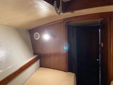 Slide: The Image of Interior cabin of a 1969 Spencer 44 CC sailboat with wooden paneling. - 37