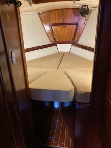 Slide: The Image of 1969 Spencer 44 CC boat cabin with wooden interior and beige cushions - 38