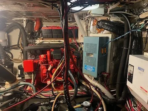 Slide: The Image of Engine room of a 1969 Spencer 44 CC boat with red engine and wiring. - 4