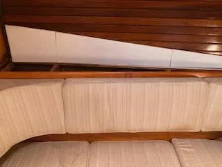 Slide: The Image of Interior seating of a 1969 Spencer 44 CC sailboat with wooden paneling. - 47