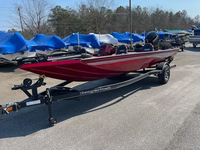 Slide: The Image of 2024 Ranger RT188 red fishing boat on trailer in outdoor lot. - 3