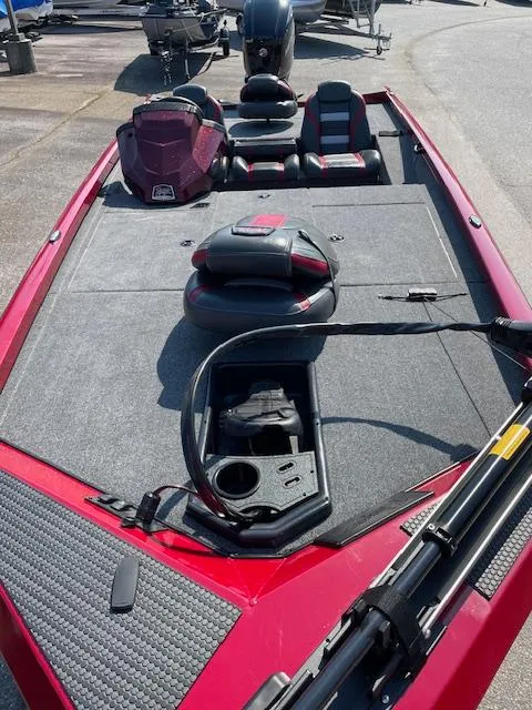 Slide: The Image of 2024 Ranger RT188 fishing boat with red and black interior, spacious deck, and storage compartments. - 4