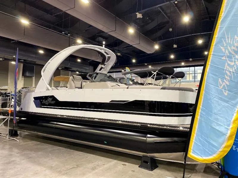 The Image of 2024 SunChaser Calais 23 SB DC pontoon boat displayed indoors. - 1