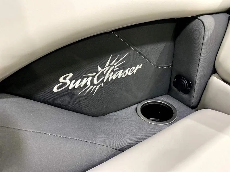 Slide: The Image of 2024 SunChaser Calais 23 SB DC boat interior with logo and cup holder. - 14