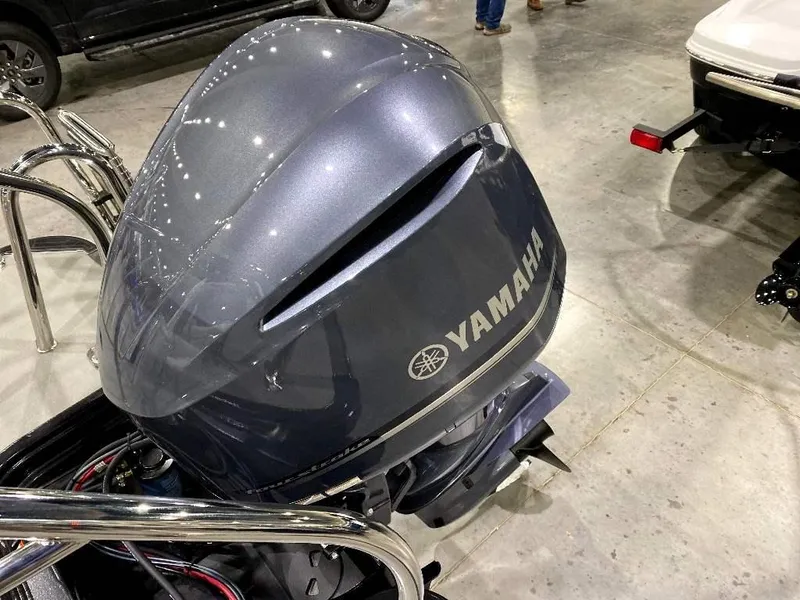 Slide: The Image of 2024 SunChaser Calais 23 SB DC with Yamaha outboard motor in showroom. - 21