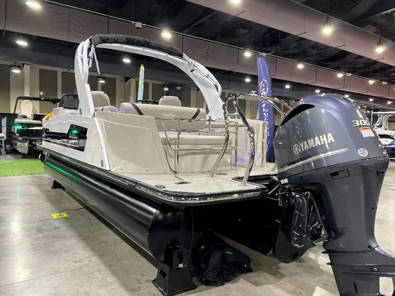 Slide: The Image of 2024 SunChaser Calais 23 SB DC pontoon boat with Yamaha 300 outboard motor displayed indoors. - 3