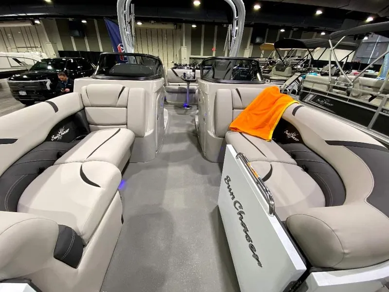 Slide: The Image of 2024 SunChaser Calais 23 SB DC pontoon boat interior with luxurious seating. - 6