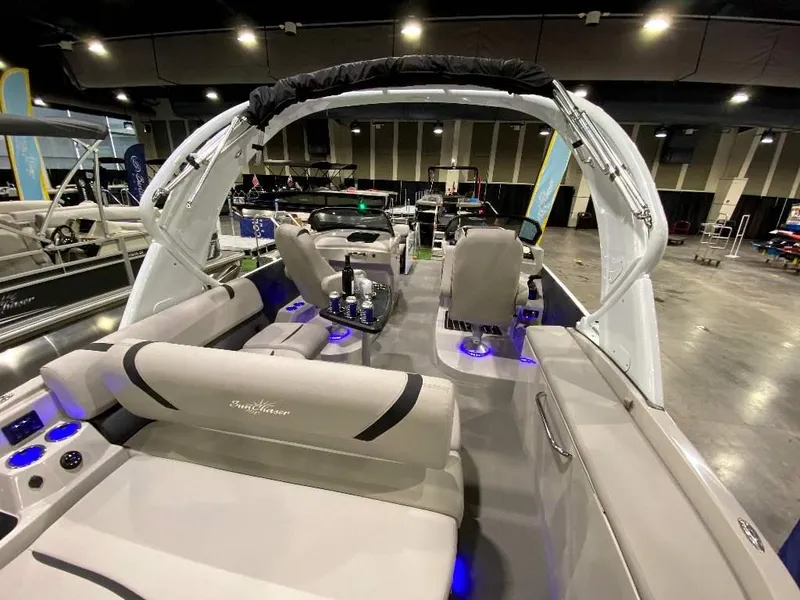 Slide: The Image of 2024 SunChaser Calais 23 SB DC pontoon boat interior with modern seating and blue LED lighting. - 7