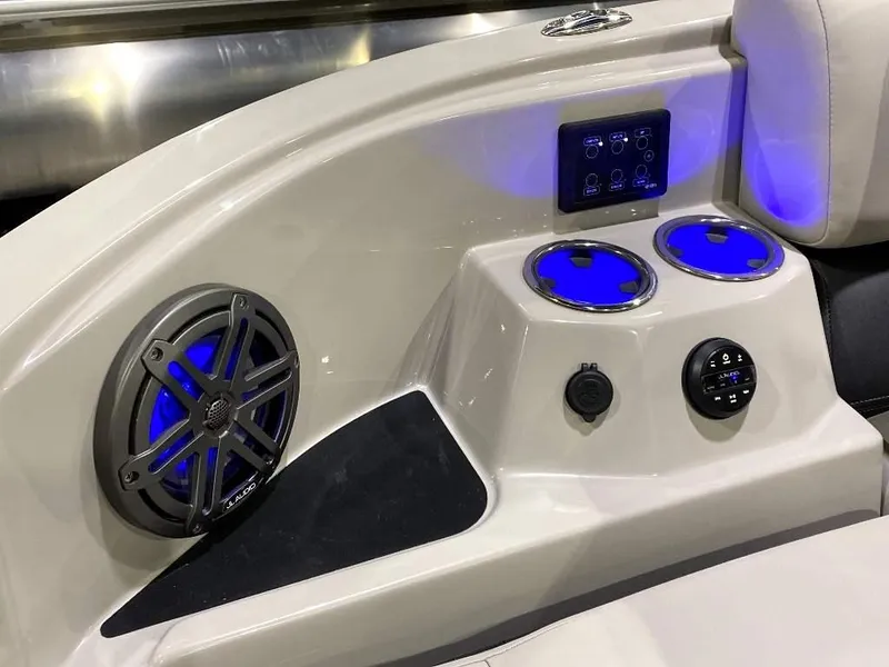 Slide: The Image of 2024 SunChaser Calais 23 SB DC boat interior with illuminated cup holders and speaker. - 9