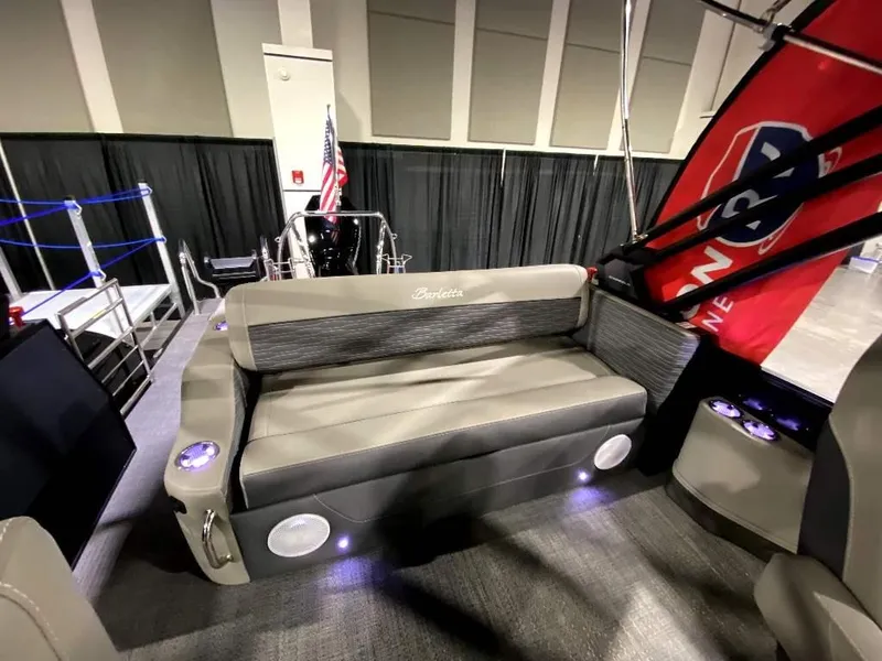 Slide: The Image of 2024 Barletta Corsa Ultra-Lounge 25UCA interior with seating and cup holders. - 10