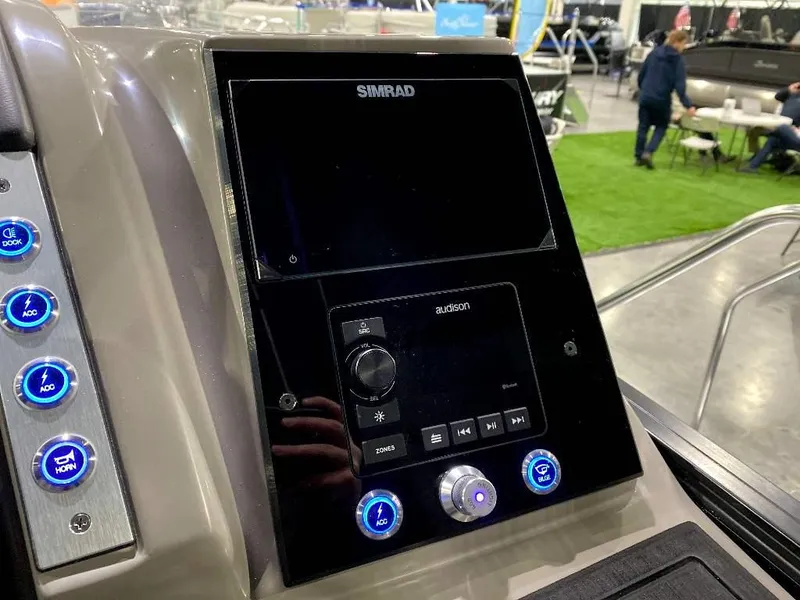 Slide: The Image of 2024 Barletta Corsa Ultra-Lounge 25UCA dashboard with Simrad display and control buttons. - 21