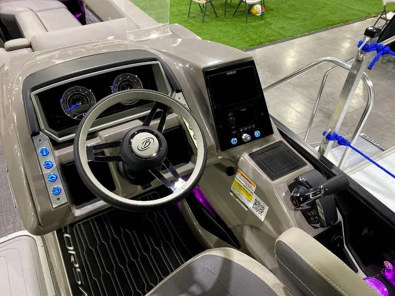 Slide: The Image of 2024 Barletta Corsa Ultra-Lounge 25UCA boat dashboard and steering wheel. - 5